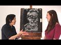 see how an art professor critiques a charcoal portrait drawing