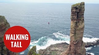 Daredevil walks tightrope from on of Britain's tallest sea stacks