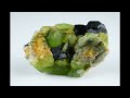 RockBot Describes... 🌍 Igneous Rocks Unveiled: Olivine & Pyroxene Crystals in Earth's Deep Mantle 🌋✨