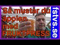 Musta äpplen med fruktpress