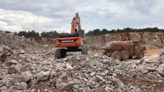 Doosan dx530 loading blasted rock