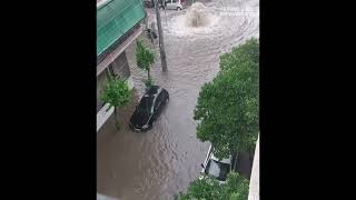 Water from sewers jetting out in flooded Athens Street as storm Daniel batters Greece