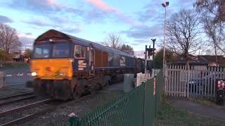 66426 with the Tesco Express at Romanby Road level crossing