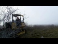 john deere 450j bulldozer clearing a residential lot