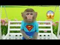 monkey baby bon bon eats kinder joy surprise eggs and plays with puppy in the swimming pool