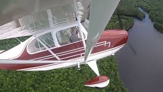 Flying my 1946, Aeronca 7AC Champ out of a grass strip in Maine.