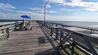 Walking on Ocean Crest Fishing Pier in Oak Island North Carolina on a Sunny Summer Day
