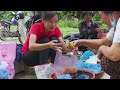 women harvesting black sugar palm fruit goes to market sell ella daily life