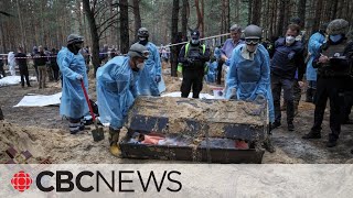 Ukraine begins investigating mass grave in Izium