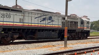 KTMB Class 26109 Tanjung Pelepas locomotive with flatbed wagons seen at Jalan Kastam station.