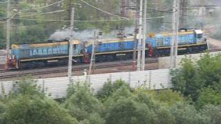 Three TEM2 diesel locomotives next to Khovrino station.