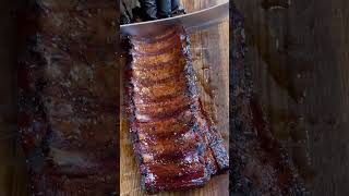 Slicing up a gorgeous rack of baby backs! 🍖🔥 #babybackribs #ribs #foodie