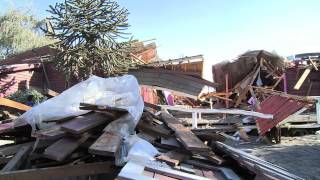 Residents shovel Calbuco ash and debris off their rooftops