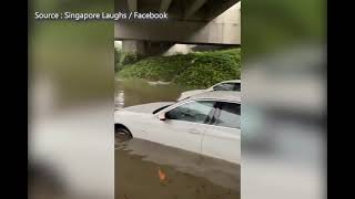 Flash floods in parts of S'pore due to heavy rain; vehicles seen trapped at flooded Tampines-Pas...