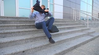 Dolly Shot of Desperate Young Businessman Sitting on Stairs Near Office Building | Stock Footage -