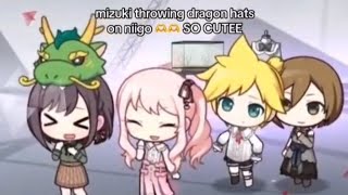 Mizuki throwing dragon hat on niigo