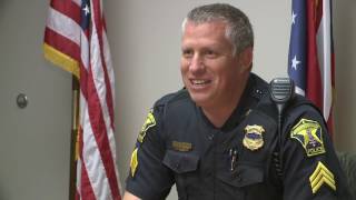 Strongsville police officer plays with children during school