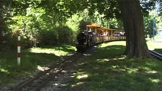 Liliputbahn - steam locomotive at railway crossing