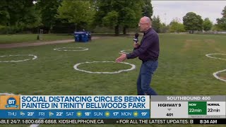 Park crews painting social distancing circles at Trinity Bellwoods Park