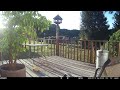 Gray squirrel out on the railing for some birdseed. Pretty female cardinal under the table trailcama