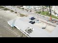 maxim crane works operating a massive crane on the galveston seawall 4k drone video