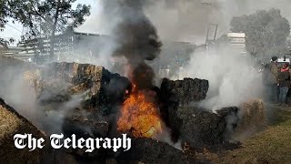 Farmers block Toulouse airport entrance and burn straw bales