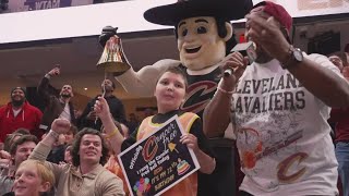 Young cancer survivor rings bell at Cavs game and receives standing ovation