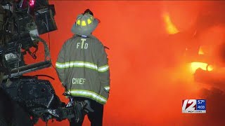 Flames rip through pile of crushed cars in Tiverton auto lot