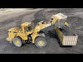 caterpillar 990 wheel loader loading coal on trucks