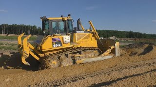 Komatsu D65EX-16 and Cat D6N XL pushing sand