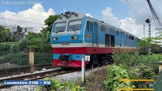 [290] Locomotive D19E - 916 pulled freight train SH33 passing through Di An City