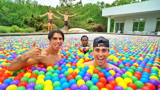 We Put 100,000 Rainbow Balls In Our Swimming Pool!