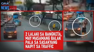 2 lalaki sa bangketa, may masamang balak pala sa sasakyang naipit sa... | GMA Integrated Newsfeed