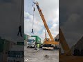 to see people lift containers in the dry port