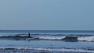 Surfer at Saltburn beach North Yorkshire on January 25th 2025.