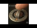 hand carved coins with hidden surprises by roman booteen