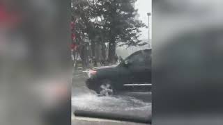 Surfers Ask Passing Cars to Splash Them