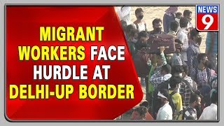 Migrant workers gather in Gazipur at Delhi-UP border