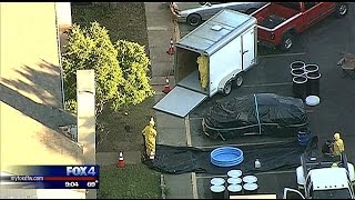 Hazmat crews clean apartment