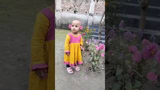 cute waniya baby in her flower garden