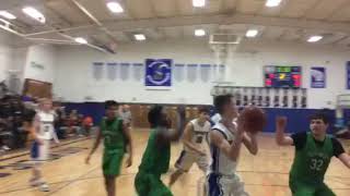 Catholic Central's Paul Nevin scores on offensive rebound
