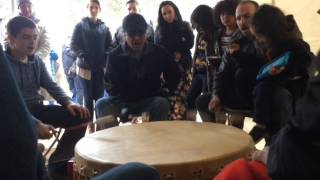 Little River Band of Ottawa Indians tribe members perform on community drum