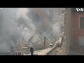 excavator on site of marseille building collapse as smoke rises voa news