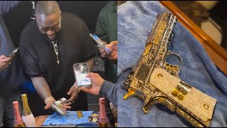 Rick Ross Speechless After His Homeboy Gifts Him A Gold 9mm Pistol For His Birthday