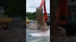 Foyel and marin dredging Hitachi EX1200 working on a new breakwater project 2023