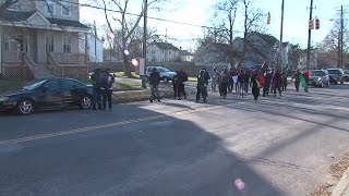 Dozens walk for justice in quintuple murder