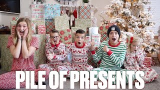 INSANE CHRISTMAS GIFTS HAUL | OPENING PILES OF PRESENTS THE DAY BEFORE CHRISTMAS