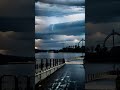 cloudy sky over a body of water with lightning hits the water