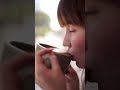 relaxing close up video of an attractive woman sipping coffee