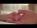 videoblocks mother and her newborn baby parent holding newborns hand happy mother and baby together